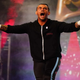 CM Punk makes his way down the entrance ramp with his arms stretched out screaming in excitement for returning to wrestling after seven years.